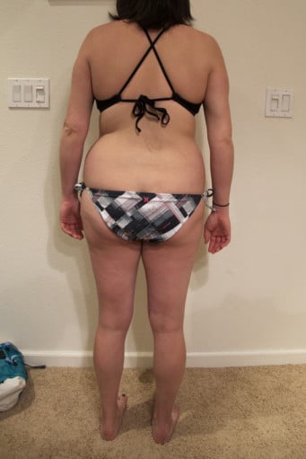 A photo of a 5'5" woman showing a snapshot of 157 pounds at a height of 5'5