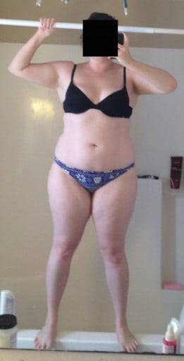 A progress pic of a 5'2" woman showing a snapshot of 166 pounds at a height of 5'2