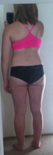 A photo of a 5'0" woman showing a snapshot of 122 pounds at a height of 5'0