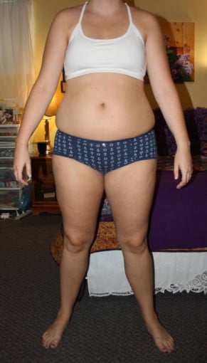 A picture of a 5'8" female showing a weight reduction from 180 pounds to 157 pounds. A net loss of 23 pounds.