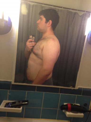A photo of a 6'1" man showing a weight cut from 264 pounds to 216 pounds. A respectable loss of 48 pounds.