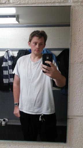 A picture of a 6'5" male showing a weight reduction from 353 pounds to 228 pounds. A respectable loss of 125 pounds.
