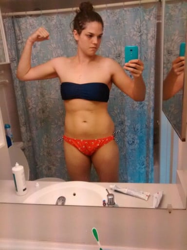 A picture of a 5'9" female showing a weight cut from 193 pounds to 165 pounds. A total loss of 28 pounds.