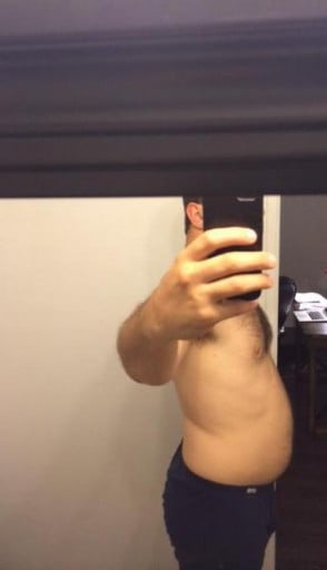 A photo of a 5'11" man showing a fat loss from 215 pounds to 185 pounds. A net loss of 30 pounds.