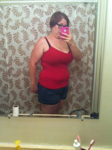 A picture of a 5'8" female showing a weight cut from 265 pounds to 195 pounds. A respectable loss of 70 pounds.