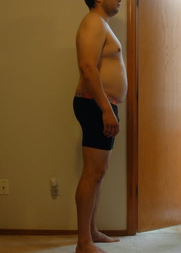A photo of a 6'0" man showing a snapshot of 221 pounds at a height of 6'0