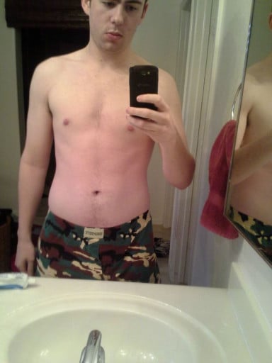 A before and after photo of a 6'2" male showing a fat loss from 220 pounds to 166 pounds. A total loss of 54 pounds.