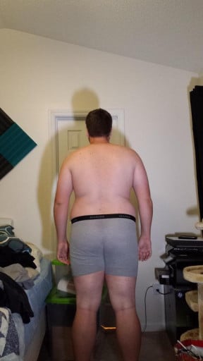 A photo of a 6'1" man showing a snapshot of 294 pounds at a height of 6'1