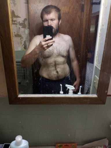 A picture of a 5'11" male showing a weight loss from 230 pounds to 176 pounds. A respectable loss of 54 pounds.