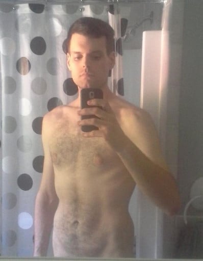A photo of a 5'11" man showing a fat loss from 225 pounds to 155 pounds. A total loss of 70 pounds.