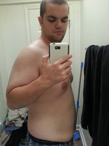 A picture of a 5'11" male showing a fat loss from 300 pounds to 223 pounds. A total loss of 77 pounds.