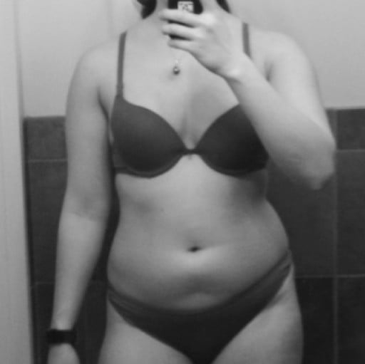 A photo of a 5'7" woman showing a weight loss from 165 pounds to 144 pounds. A net loss of 21 pounds.