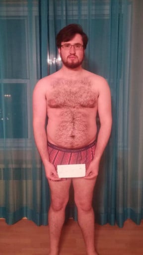 A photo of a 5'10" man showing a snapshot of 203 pounds at a height of 5'10