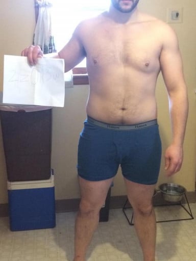 A progress pic of a 5'9" man showing a snapshot of 215 pounds at a height of 5'9