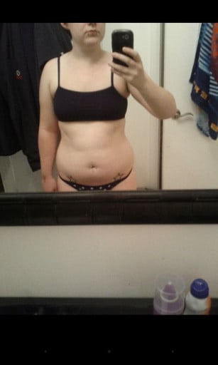A picture of a 5'4" female showing a weight cut from 154 pounds to 134 pounds. A total loss of 20 pounds.