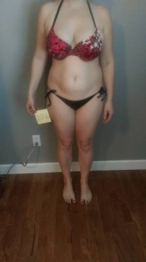 A picture of a 5'7" female showing a snapshot of 176 pounds at a height of 5'7