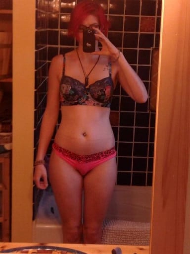 A progress pic of a 5'9" woman showing a snapshot of 135 pounds at a height of 5'9