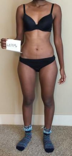 A progress pic of a 5'2" woman showing a snapshot of 107 pounds at a height of 5'2