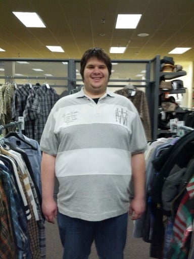 A photo of a 6'6" man showing a weight reduction from 410 pounds to 310 pounds. A total loss of 100 pounds.