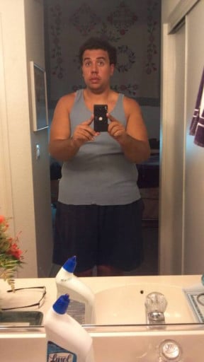 A photo of a 6'2" man showing a fat loss from 355 pounds to 275 pounds. A net loss of 80 pounds.