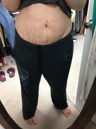 A photo of a 5'0" woman showing a weight cut from 230 pounds to 139 pounds. A total loss of 91 pounds.