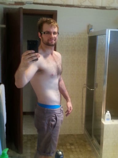 A picture of a 6'2" male showing a weight cut from 235 pounds to 191 pounds. A total loss of 44 pounds.