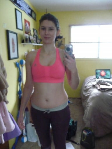A picture of a 5'8" female showing a weight cut from 148 pounds to 143 pounds. A net loss of 5 pounds.