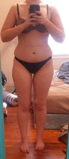 A before and after photo of a 5'2" female showing a weight cut from 143 pounds to 135 pounds. A net loss of 8 pounds.