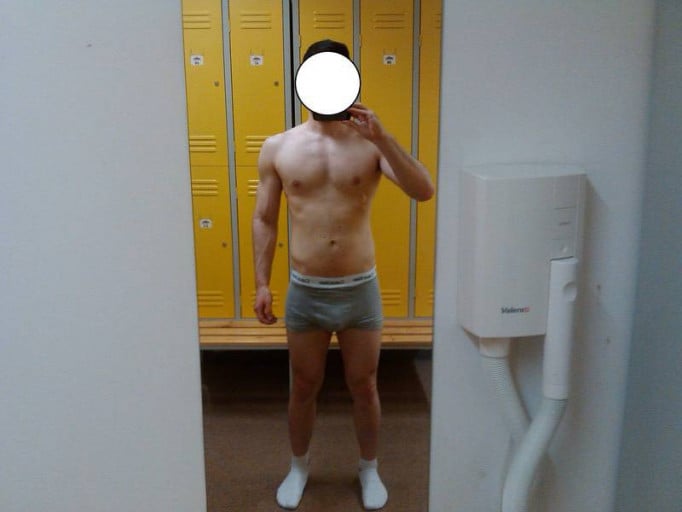 A picture of a 5'11" male showing a weight cut from 235 pounds to 170 pounds. A net loss of 65 pounds.